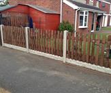 6' x 3' Round Top Picket with Concrete Posts and 6" Concrete Rock Faced Gravel Boards